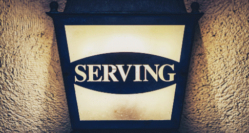Image of light fixture that says serving. 
