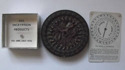 Cipher items donated to the NCMF by Dr. David Kahn, including an early DES encryption chip from 1978 encased in acrylic (at the time this chip was referred to as the world’s smallest computer)