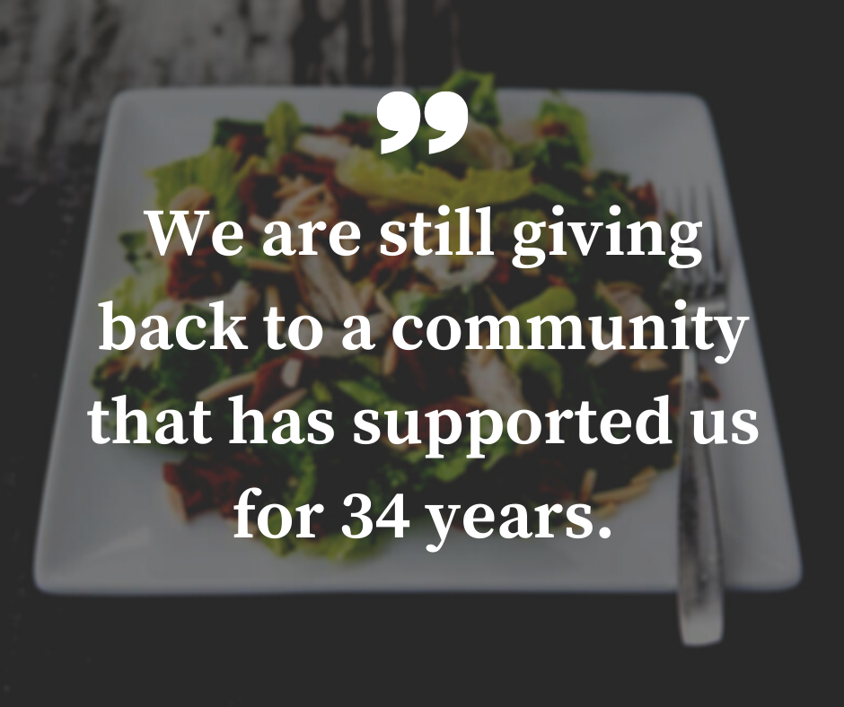 An image of a salad from trio's restaurant in the background with a pull quote in the foreground that reads "we are still giving backs to the community that has supported us for 34 years."