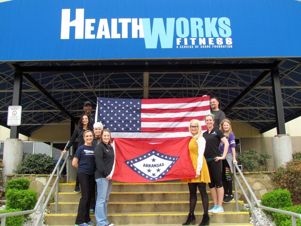 WoodmenLife presents flags to HealthWorks