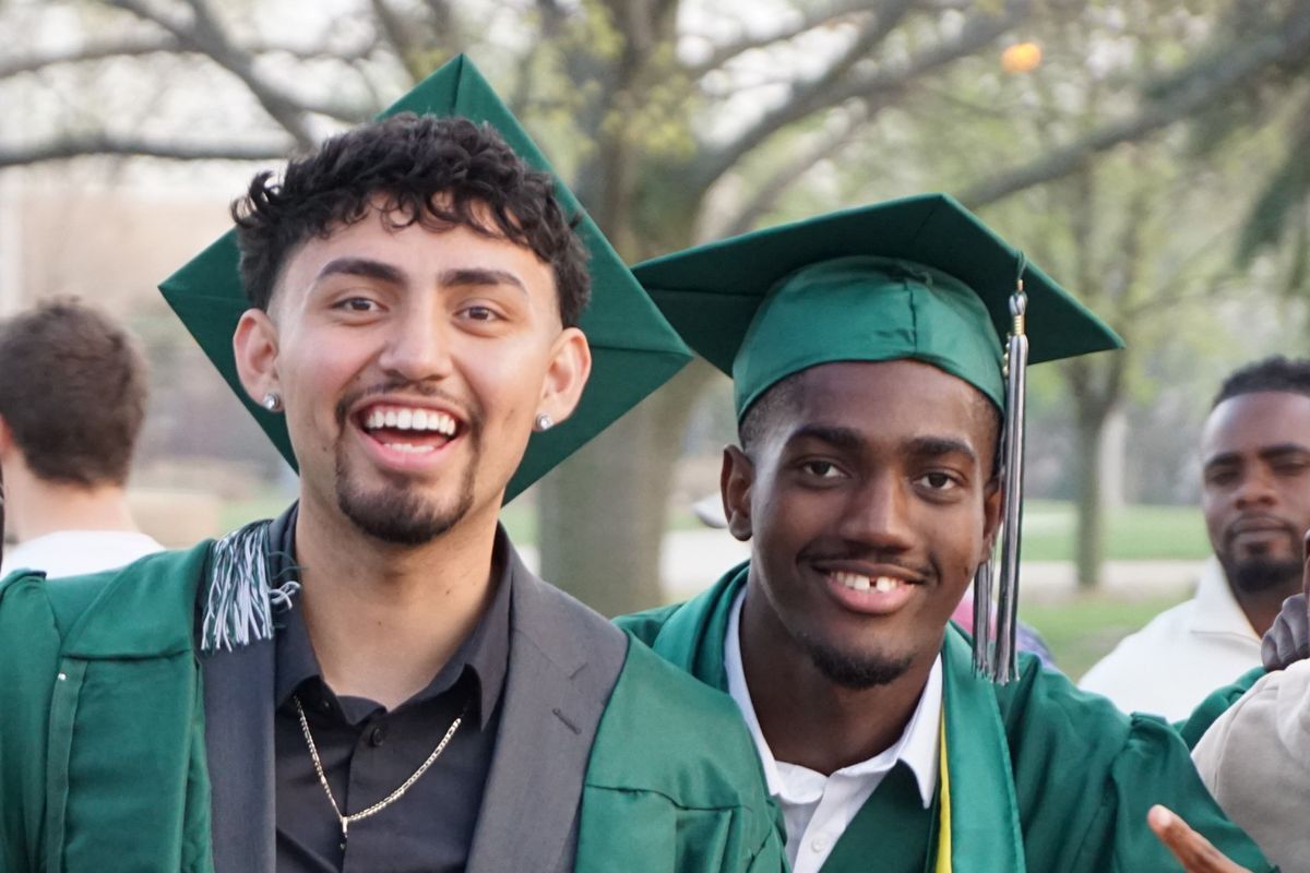 two excited graduates of central community college