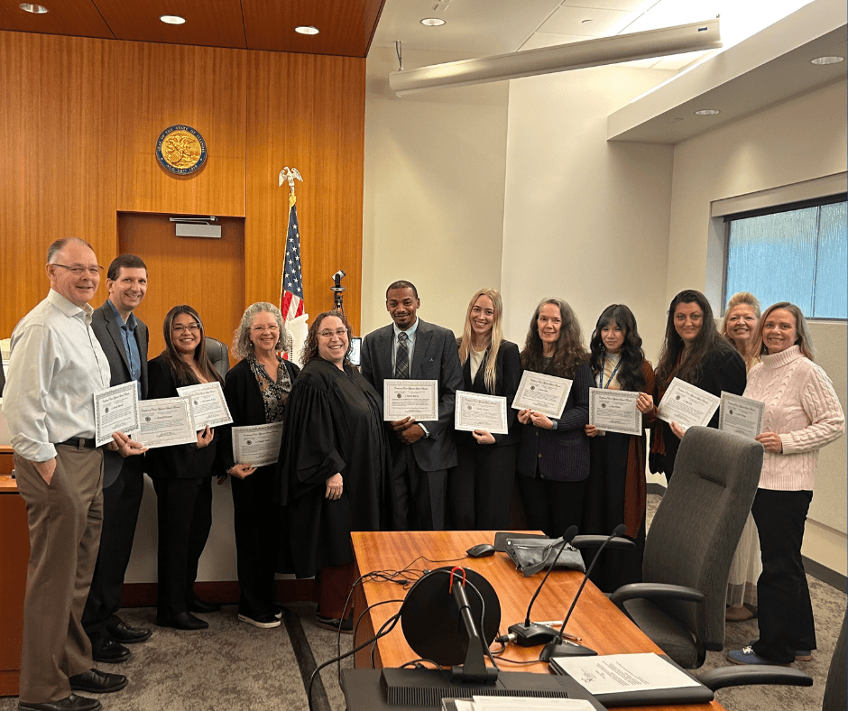 Class photo at court-house swearing in ceremony 