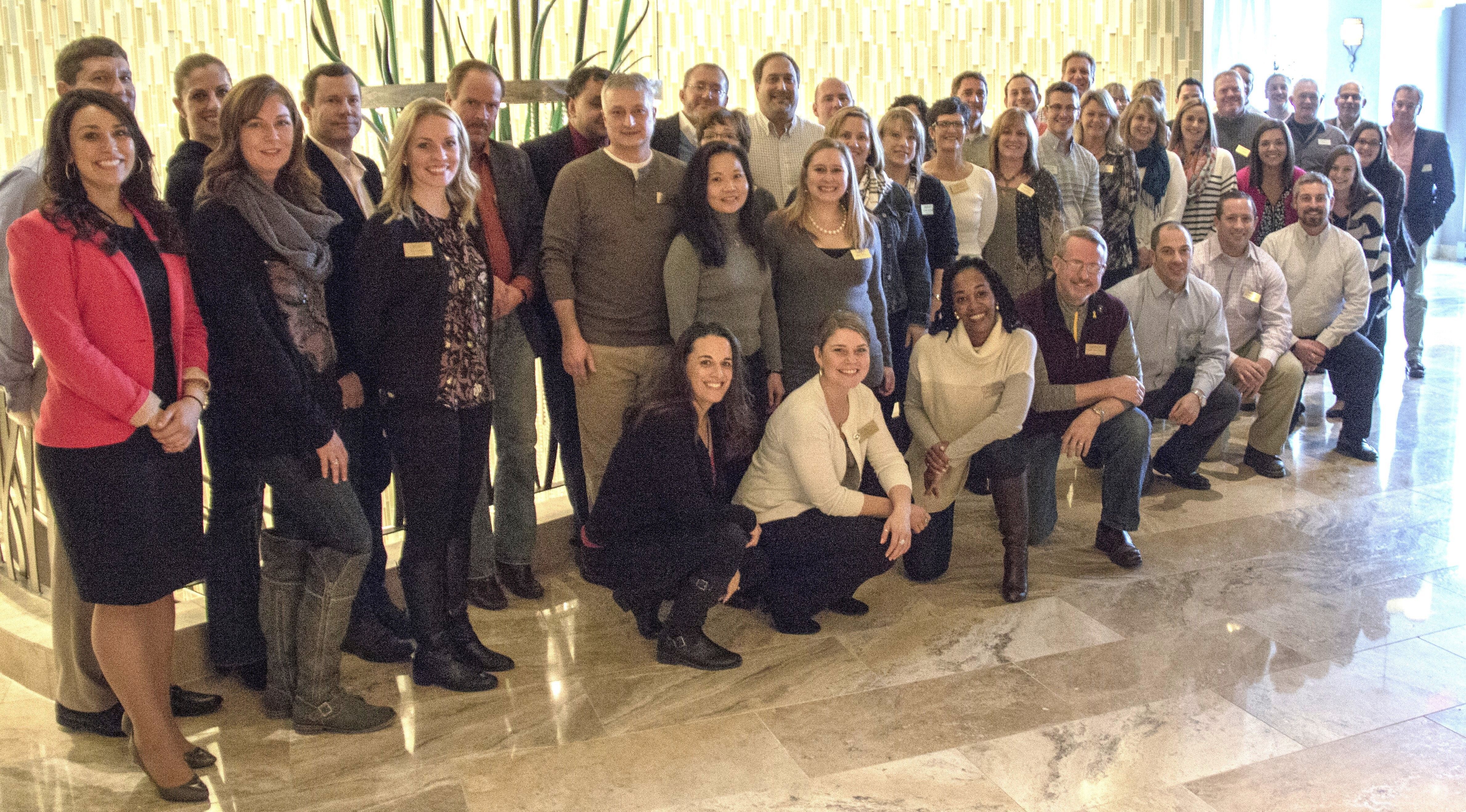 A group of people posing for a group photo