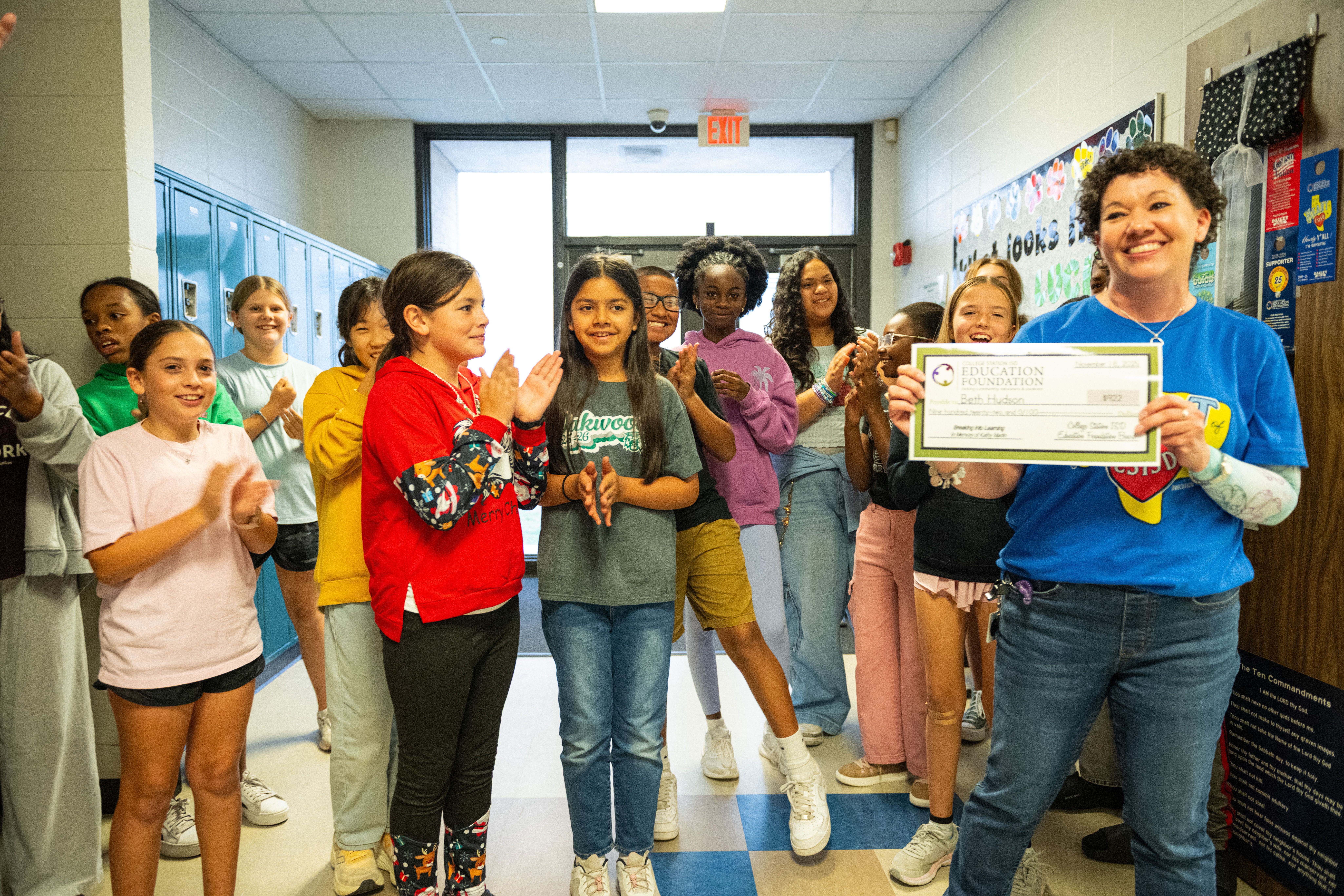 Teacher receiving a grant check from the Education Foundation.