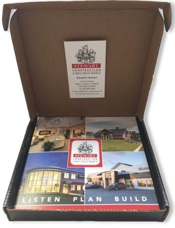 Open box with stewart construction brochure inside