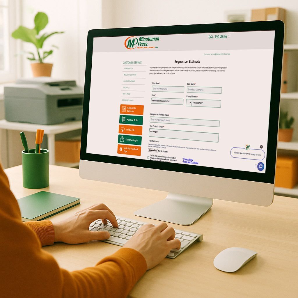 Side-angle image of a person uploading design files on a computer at a bright desk, Minuteman green and orange palette, daylight, printer workspace in background, overlay text “Upload Your Print Files Online.” (1:1 ratio)