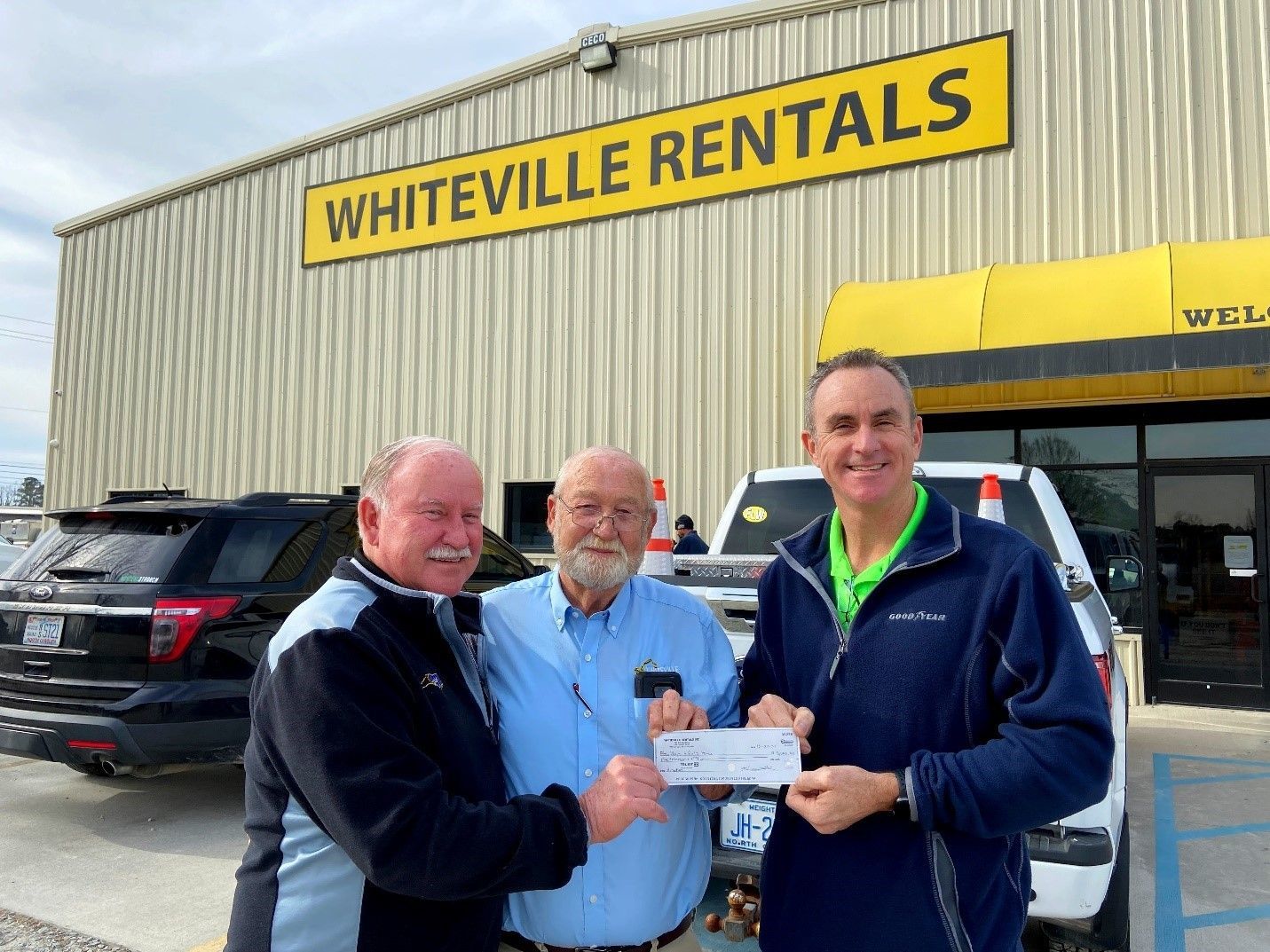 Boys and Girls Homes of North Carolina Trustee and Black’s Tire & Auto Service’s Rick Benton II, right, accepts a donation check for $5,000 from Ken Thomas of Whiteville Rentals, center, alongside Ricky Benton of Black’s Tire & Auto Service.