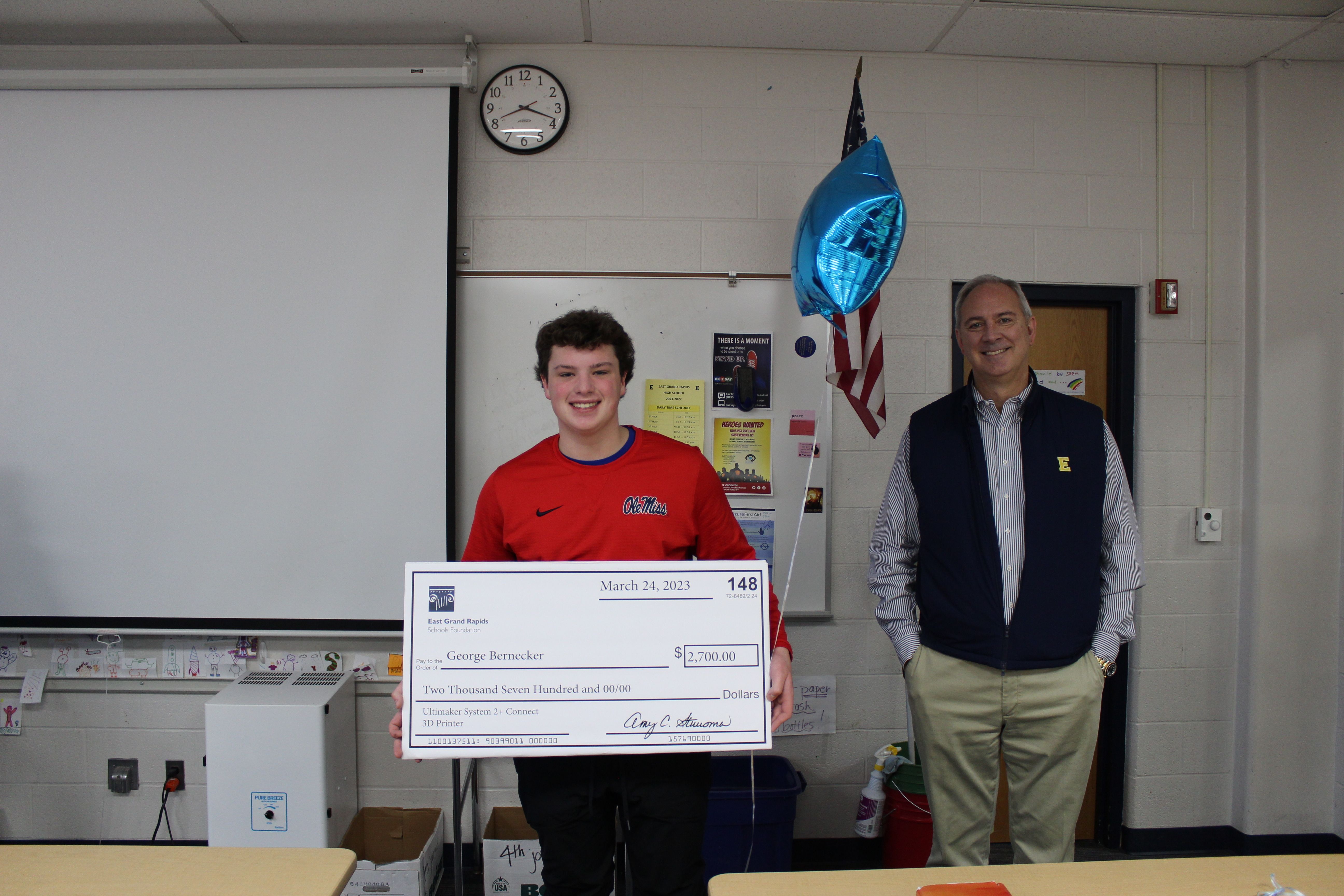 photo of George Bernecker with big check