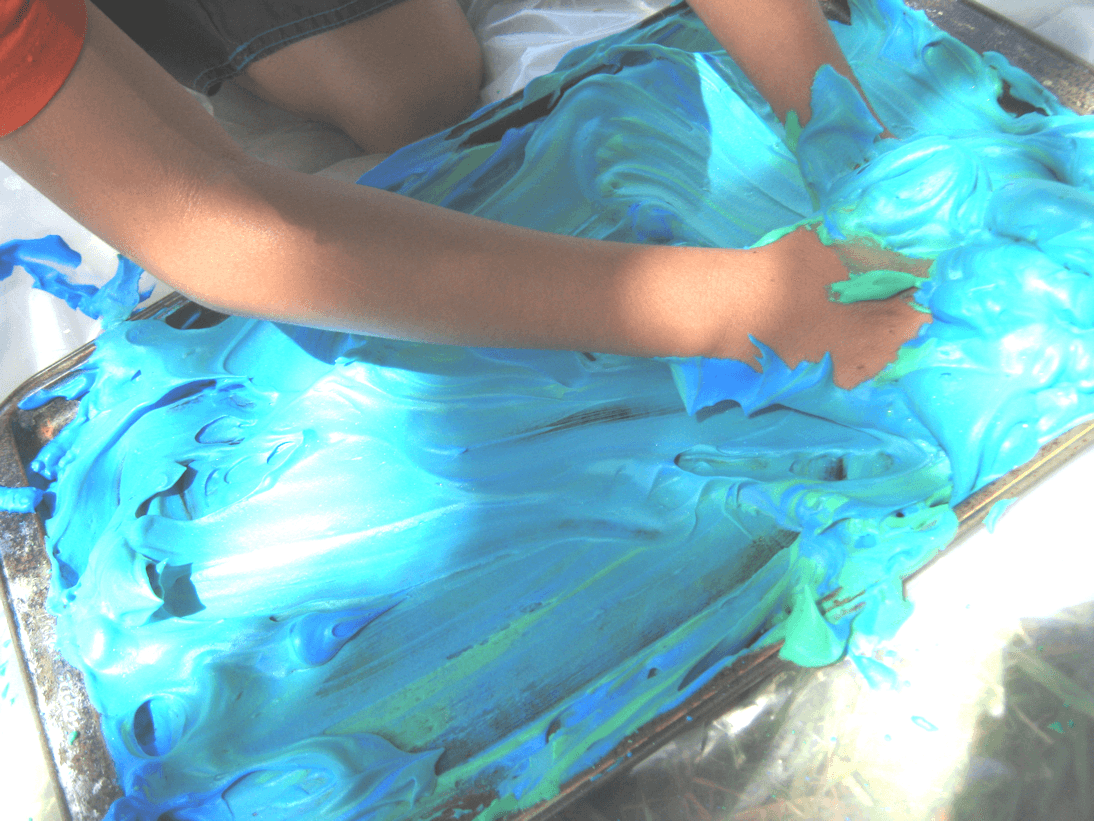 Student creating art with foam paint