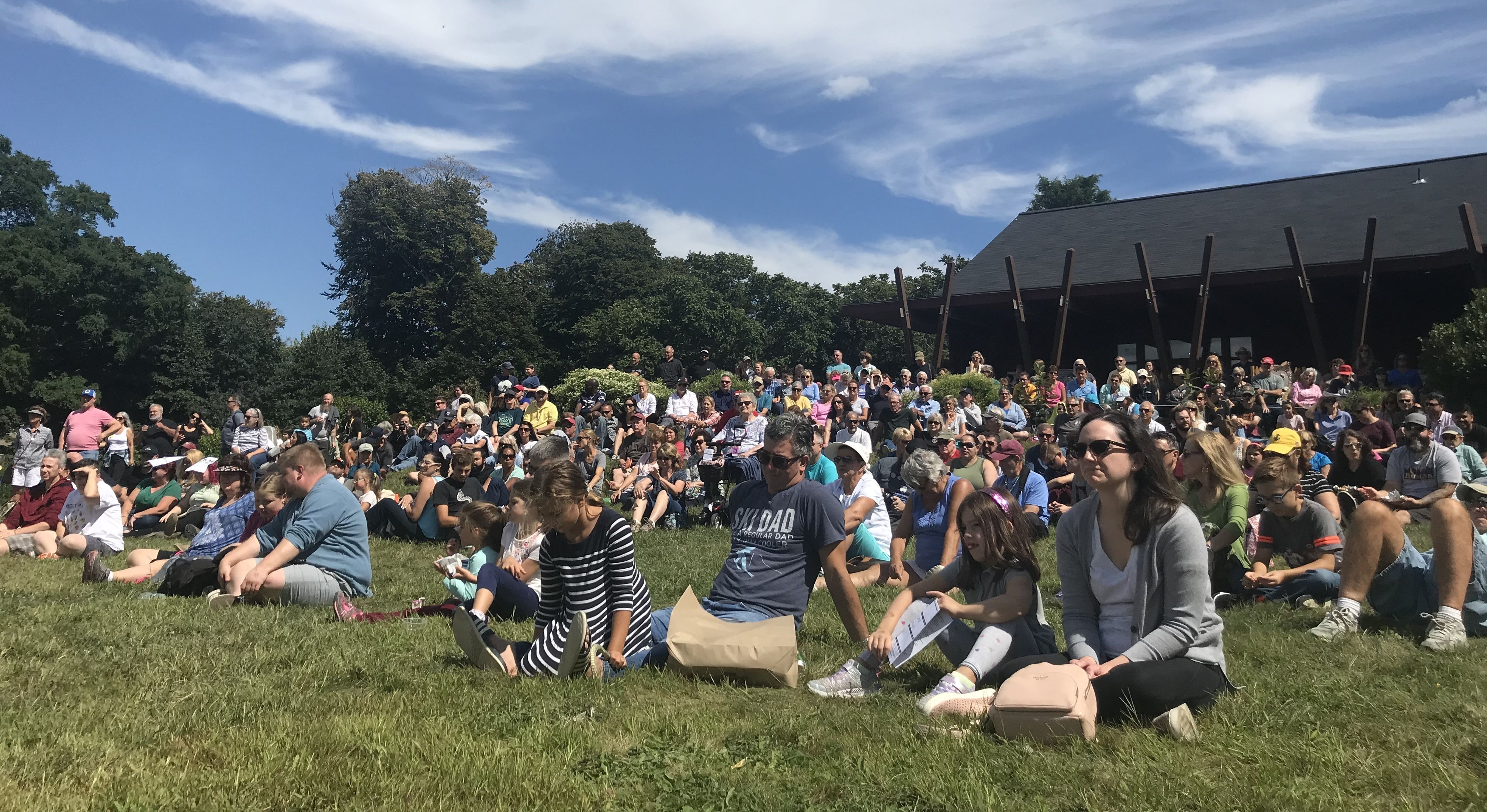 Raptor Weekend Crowd sitting on the lawn to watch flight presentation