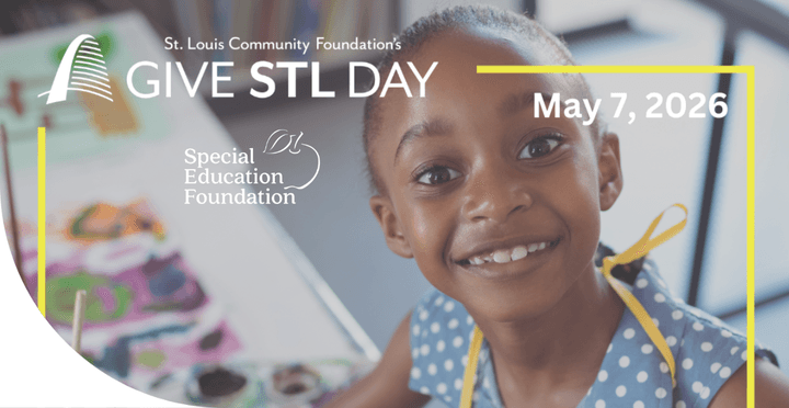 girl wearing a polka dot shirt smiling