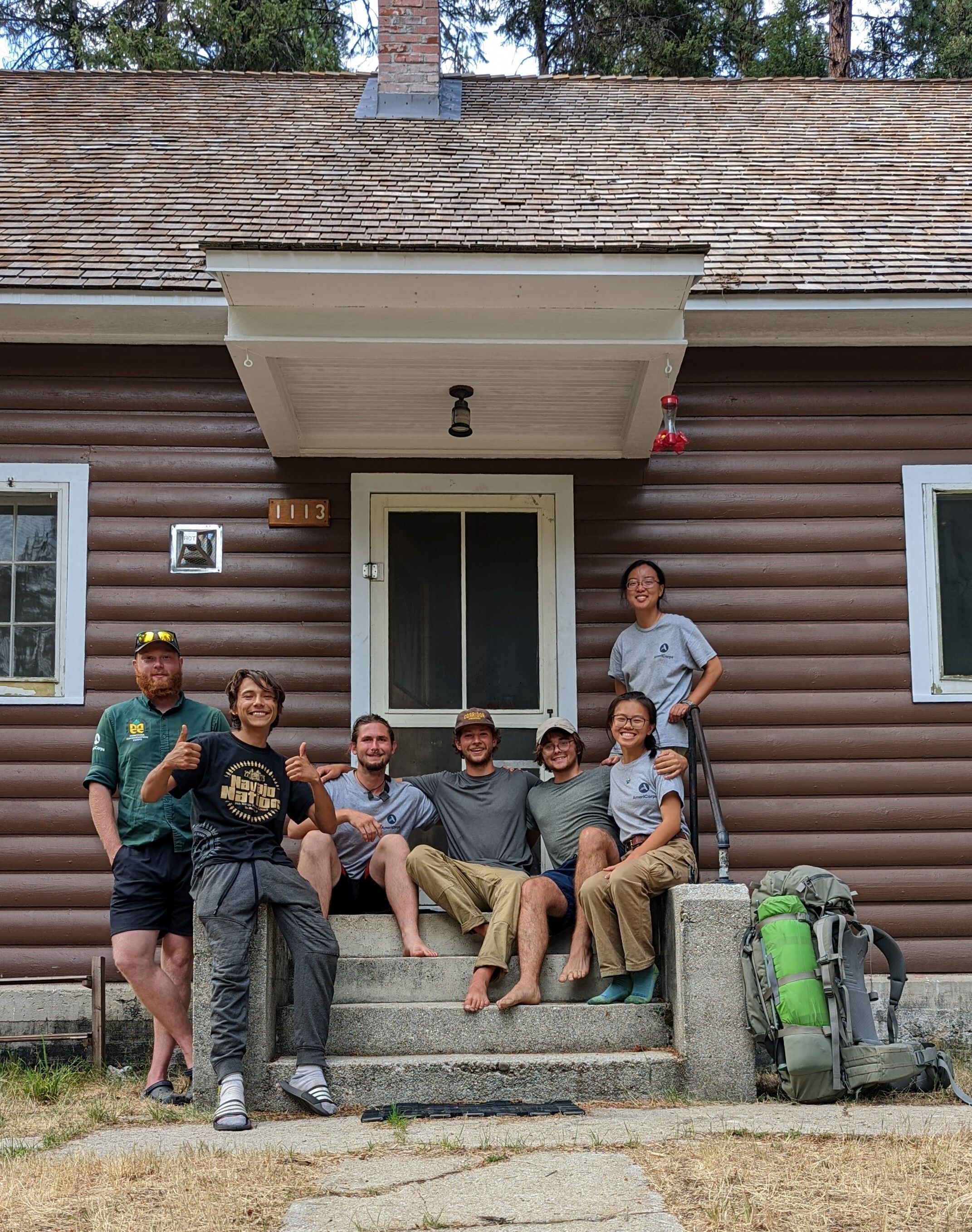 The Wildland Restoration Crew poses on the cement stairway to the Krassel Work Center.