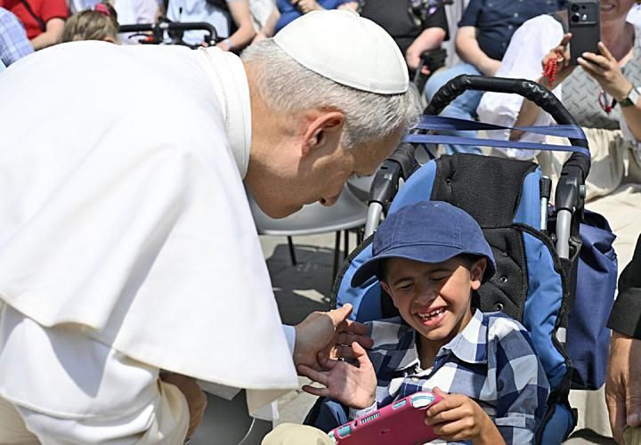 Pope Leo XIV meets 7-year-old Dominic Improta during the June 11, 2025, Wednesday audience in St. Peter’s Square.