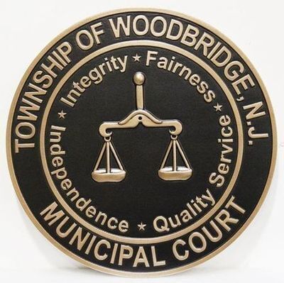 Township of Woodbridge, N.J. Municipal Court Seal – A black and gold emblem featuring balanced scales surrounded by guiding principles such as integrity, fairness, and independence, symbolizing the court's commitment to justice and service.