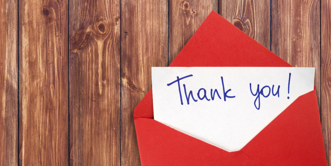 a thank you note in a red envelope
