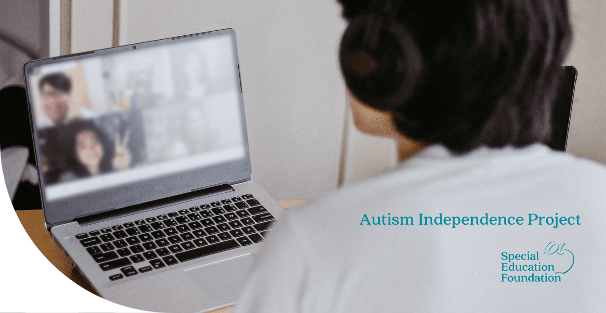 boy on a laptop with headphones