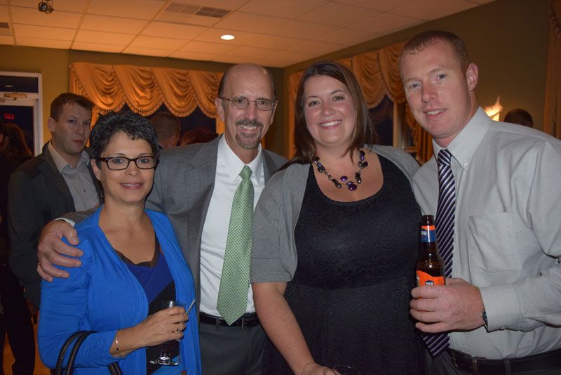 Staff members Denise Burgio, Darby Walsh, Amy Johnson and husband Gary Johnson