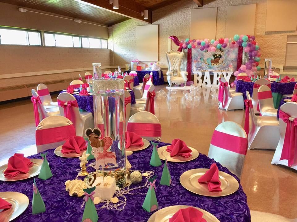 The venue in St. Martin Center is decorated in pink and blue for a baby shower.
