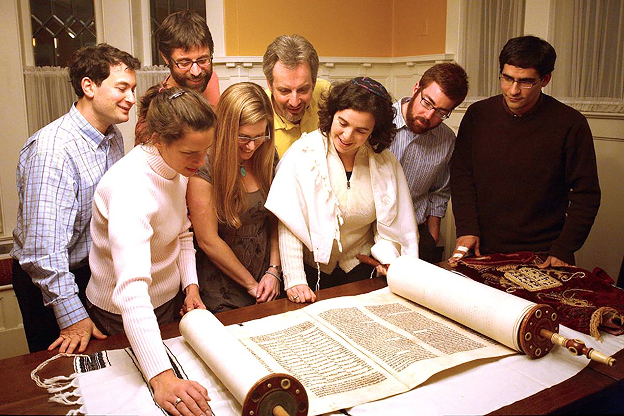 Rabbi Nussbaum and members of Kavana during the restoration of the Torah.