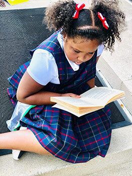 Child reading a book.