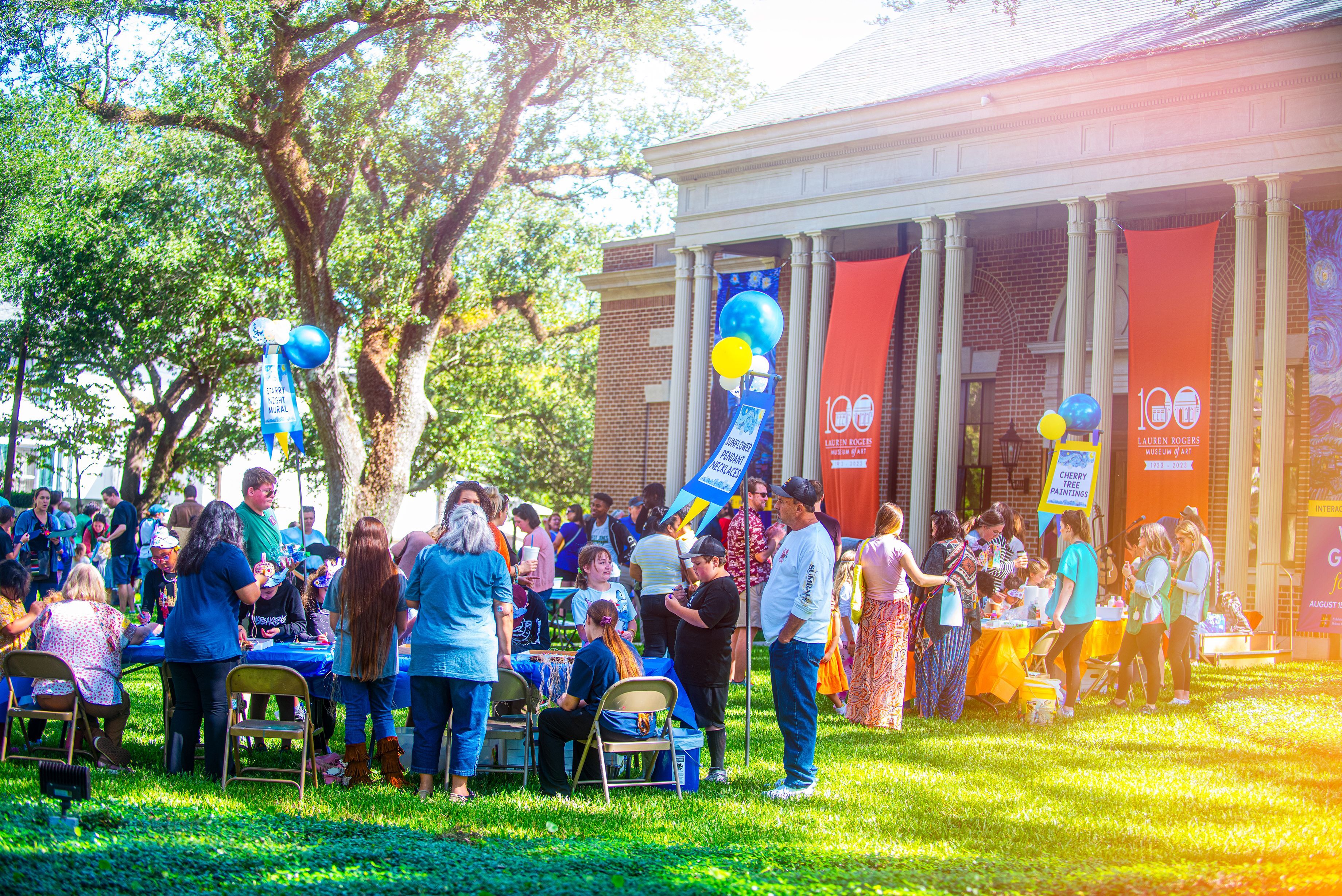 outdoor arts festival in front of a museum