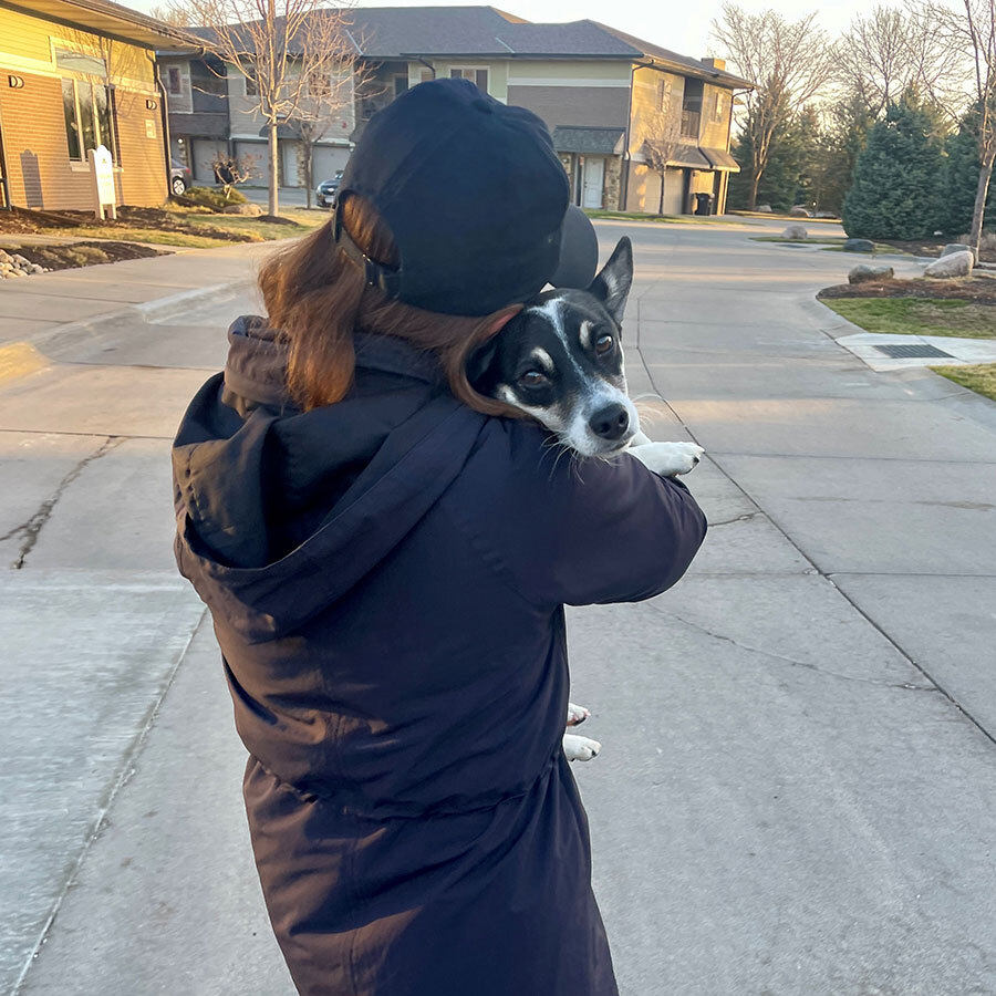 Jenny Chapin holding and hugging Patch, her new dog.