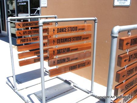 FA16672- Wayfinding and Directional Wooden Signs Hung from a Steel Frame