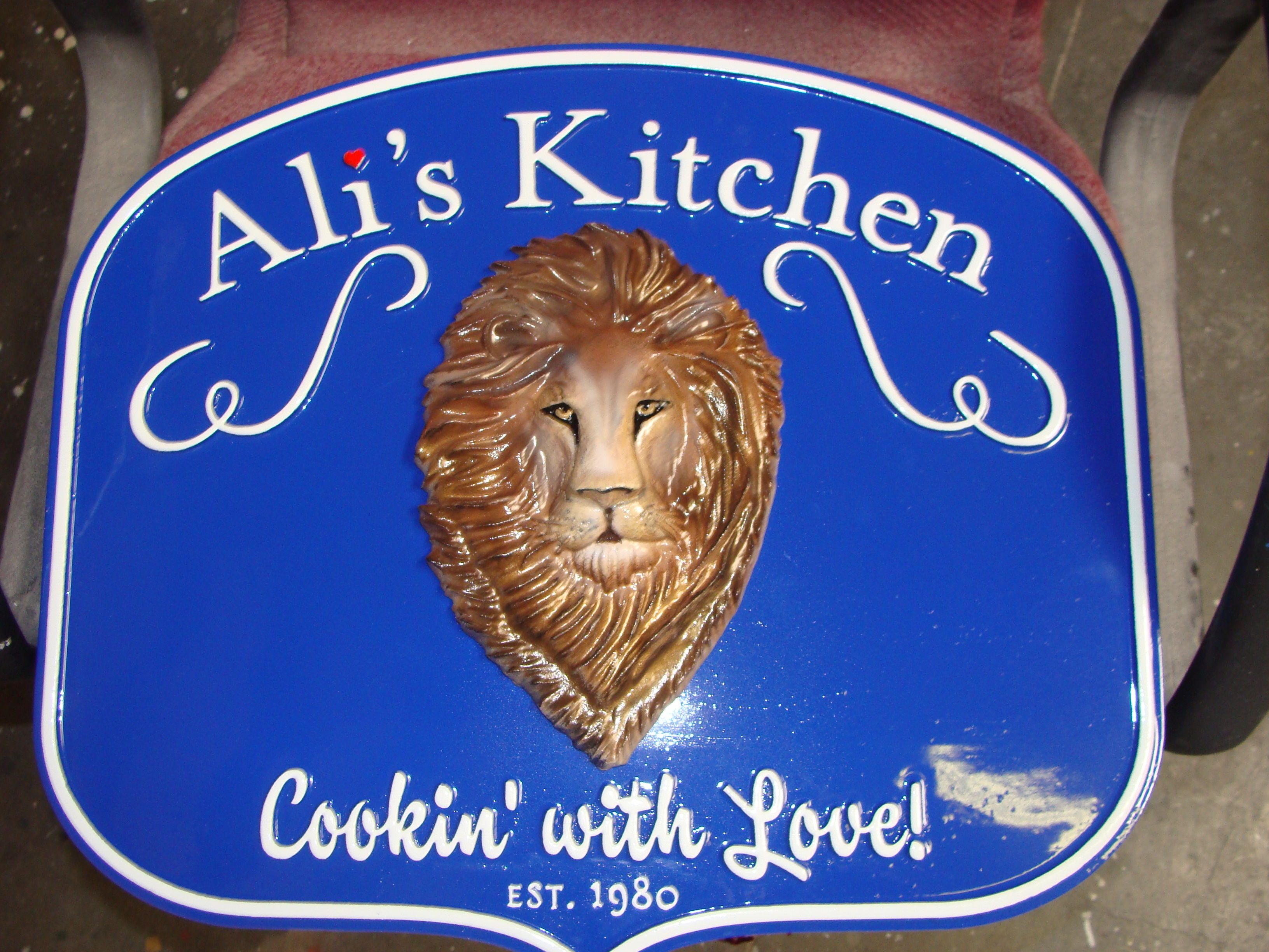 Q25045 - 3D Carved HDU Cafe Sign, with Lion Head, "Ali's Kitchen"