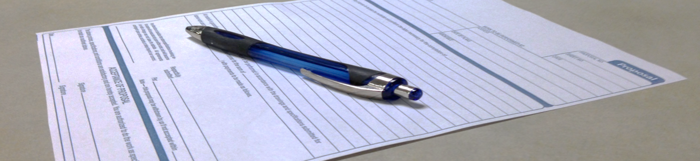 Business Form on Table with Pen