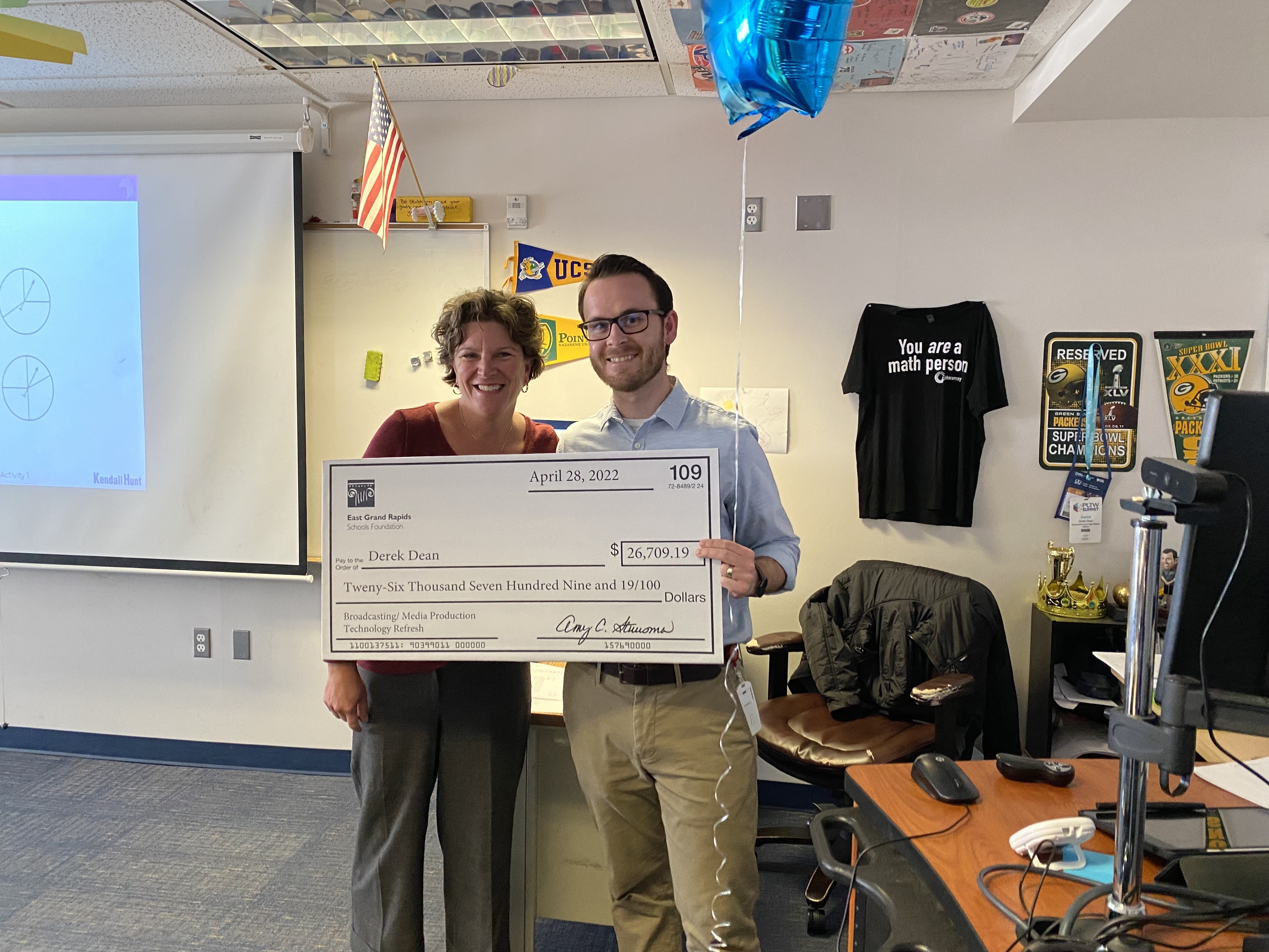 photo of Derek Dean with big check