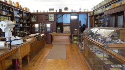 General Store interior with shelves and cases.
