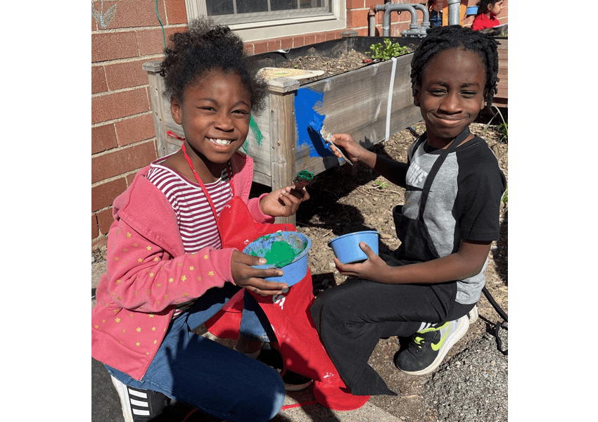 Children painting flower bad