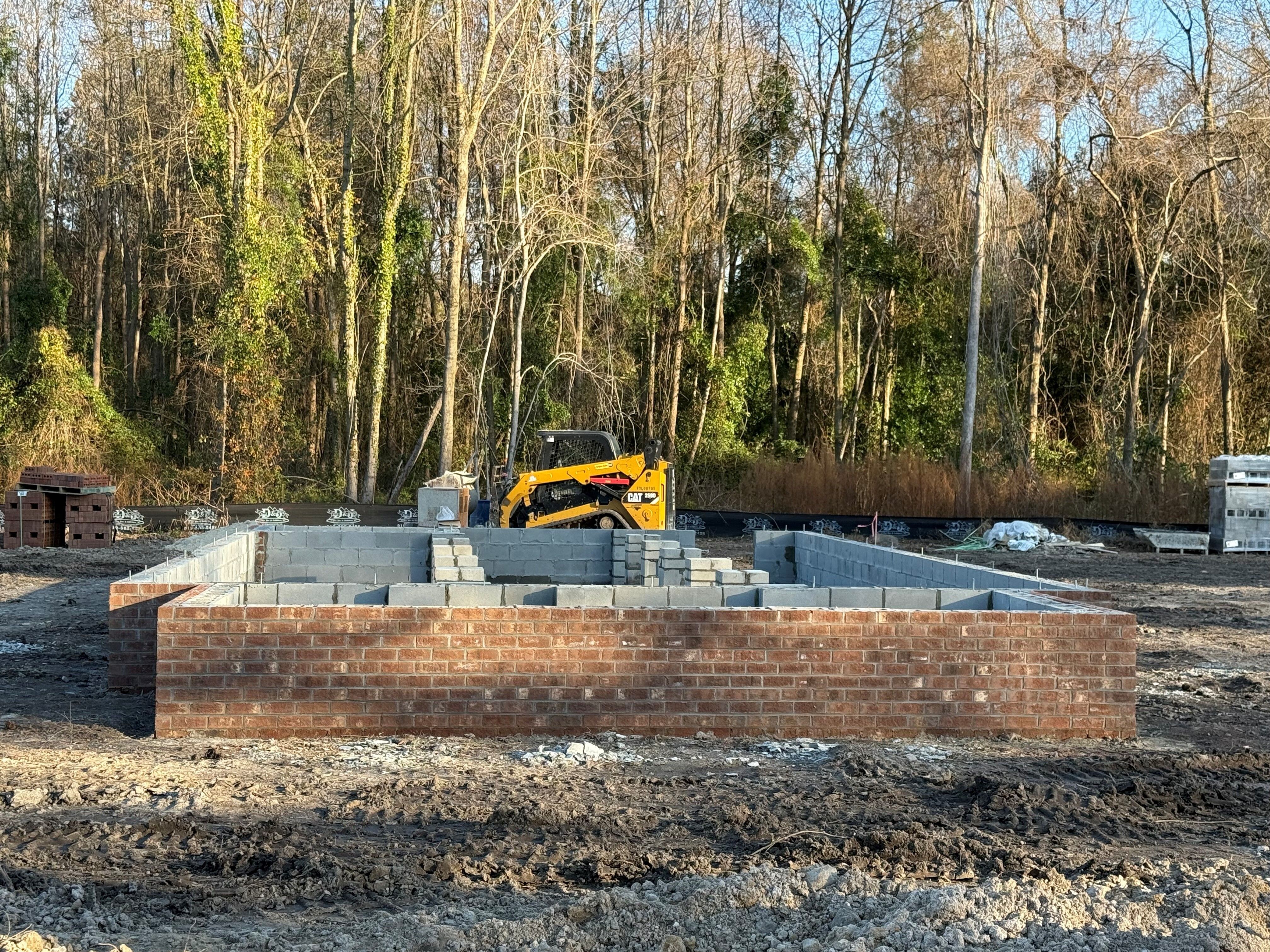 Open grassy field with gravel path.