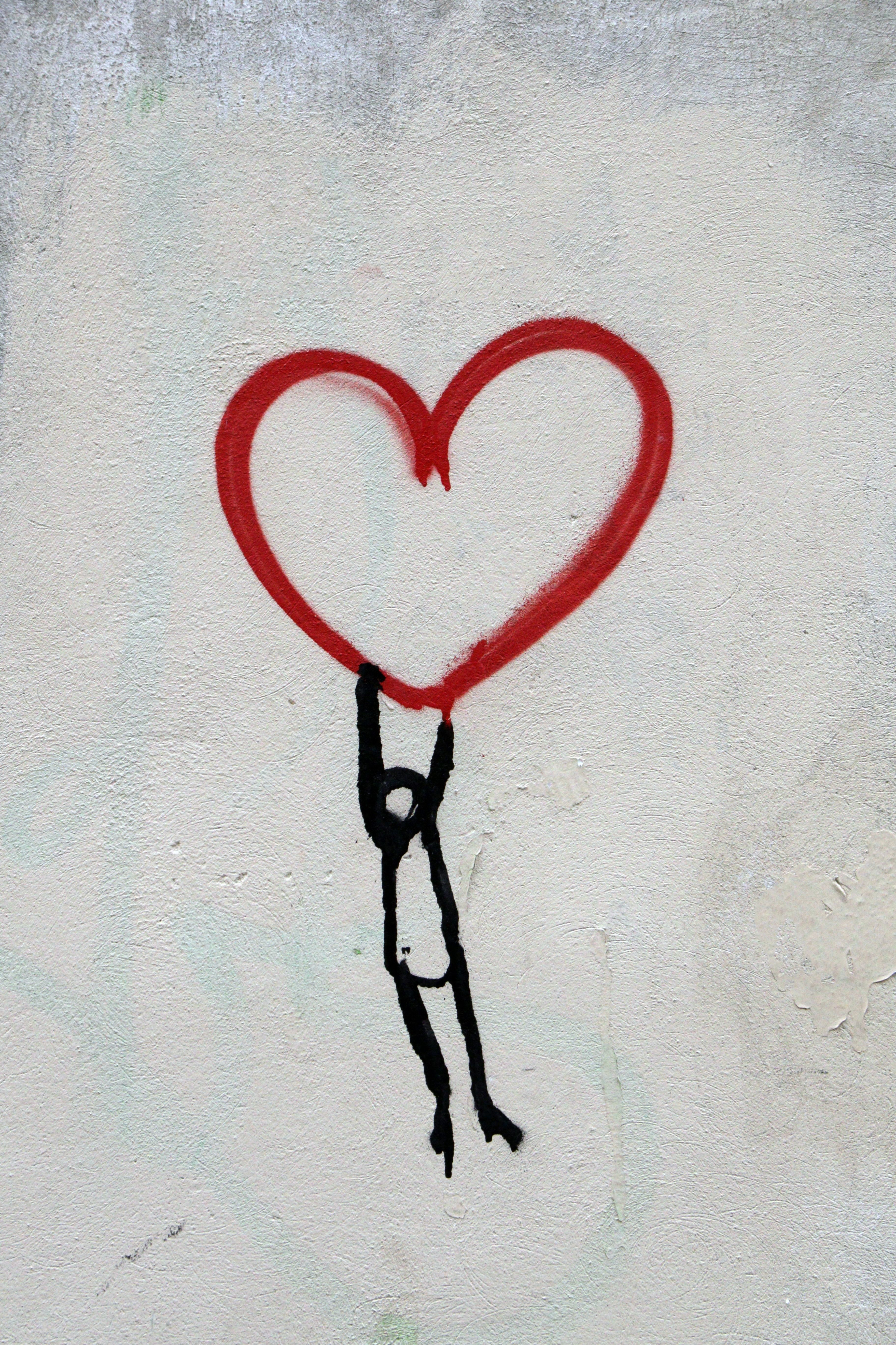 drawing person holding heart