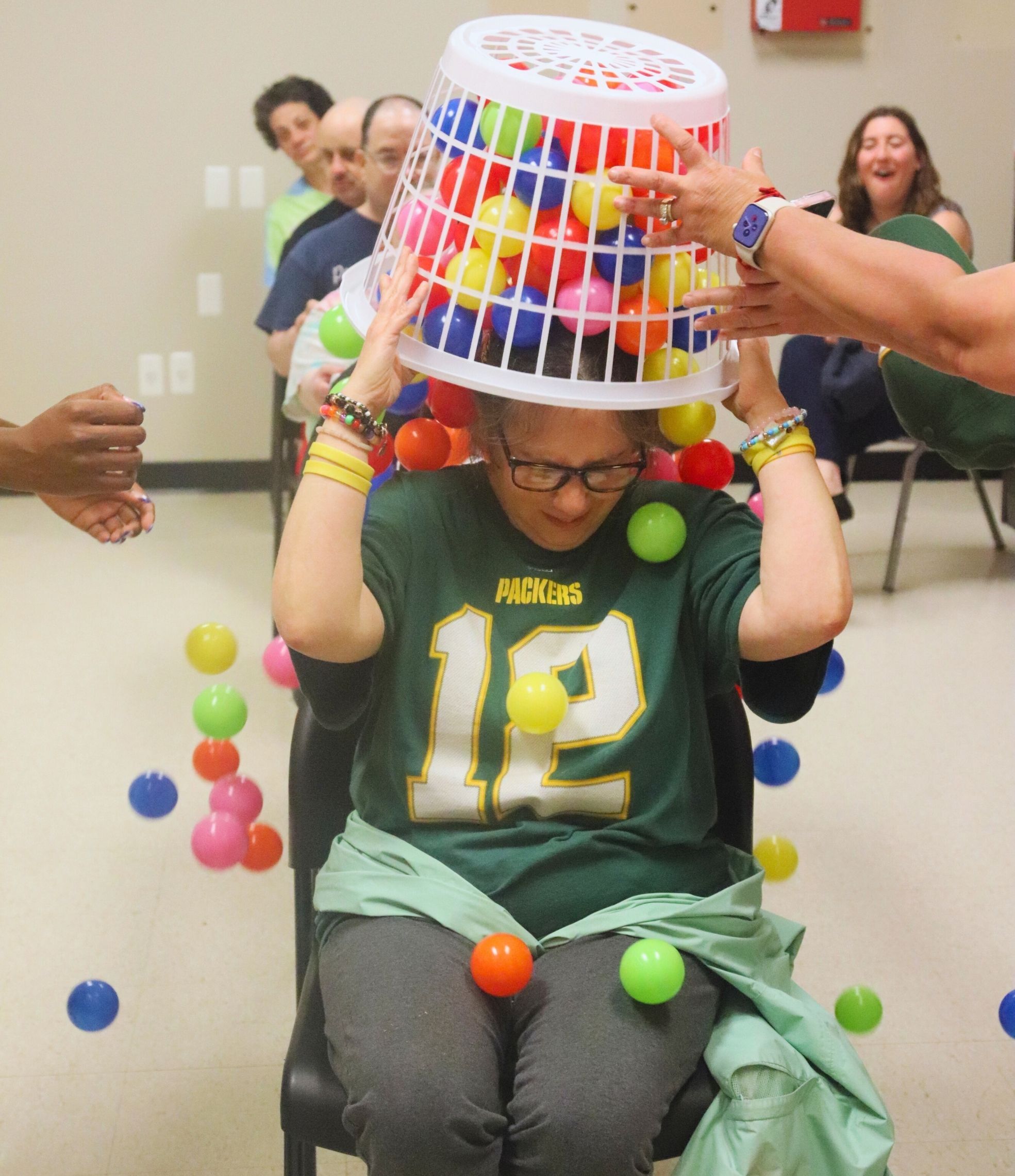 Woman playing a game with colorful balls