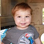 Young boy smiling for camera